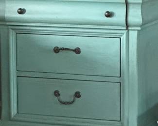 robins egg blue side table with 3 drawers.  top drawer is felt lines.