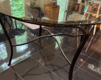 $320 USD     MAKE OFFER Round Smoke Glass Top Dining Table w Black Wrought Iron Base TM193-10    Beautiful smoke glass round top with wrought iron X trestle base. 

Dimensions: 48 x 48 x 29"H

Condition:  Very good condition

Local pick up Sterling, VA.  Contact us for shipper suggestions.      https://goodbyhello.com/products/round-glass-top-dining-table-tm193-10?_pos=13&_sid=07fb111e5&_ss=r