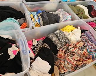 Lots of tubs of new clothing