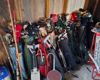 Tons of golf clubs and golf balls