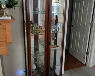 Curio Cabinet
Lighted, mirrored ,with glass shelves