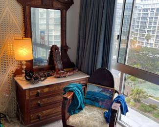Eastlake dresser with mirror and wild armchair - victorian era - has a lot of sass. 