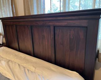 King size wood panel bed frame/headboard. 
70.5w x 86d x 57.5h Excellent condition with one small chip in wood on base towards foot board. 