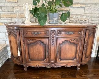 PRESALE AVAILABLE! Antique French Country demilune buffet / sideboard – 40.25h x 22d x 83w. Pulled from a Lake Geneva, WI estate. Original key included. Single large interior shelf holds large hostess items. Dovetail drawers. Curved side cabinets with shelves. Beautiful hardware.