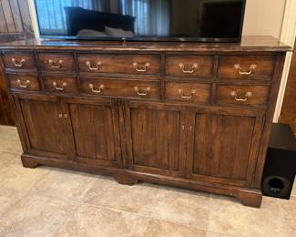 Large sideboard/console. 10 drawer over full 4 door cabinet. One interior shelf in cabinet. Very good condition and useful in many areas -  bedroom, dining room, etc. 73w x 39h x 23d