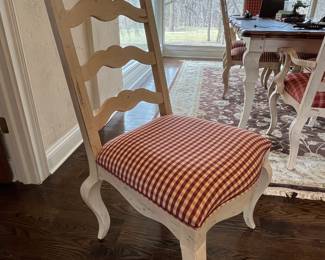 French country dining table.  72L x 44w - shown with one 20” leaf installed. One additional leaf available. 8 cream colored side chairs, 2 captain armchairs with coordinating French red fabric. 
