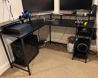 Black Corner Desk – outlet center in back corner, LED strip light under top shelf. 55” from wall to right edge and 48” from back wall to left edge. 29.5h desktop 18”d workspace