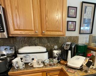 Small appliances including Keurig coffee maker, 18qt roaster, Foreman grill and more.