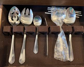 Stainless Steel serving pieces in chest