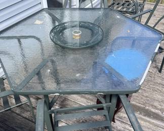 Patio glass top table with 4 chairs