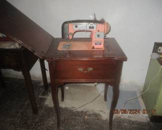 Modernage sewing machine in cabinet