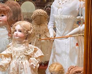 DOLL ON RIGHT IS SOLD