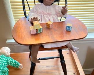 Hand made Porcelain crying child doll in high chair.