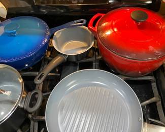 Enamelware cookware in red and blue.