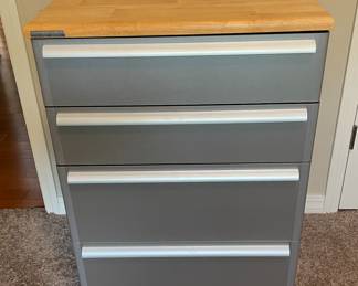 California Closets 4 drawer rolling caddy with Butcher block top. Wood top does have 3 scuffs, one on the right side. 