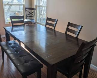 Large table, 4 chairs and a bench.  The leaf stores under the table for convenience.