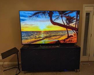 75 inch tv, blue art deco buffet, versatile small folding table.