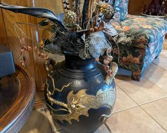 A close look at one of the black and gold dragon urns