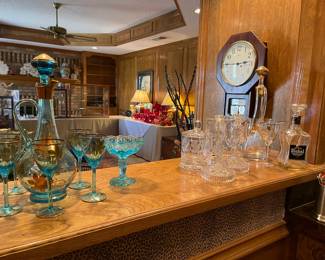 Mid-Century decanters and matching glasses, vintage candle sticks, crystal caddie. 