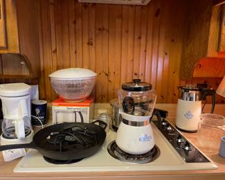 Vintage Corning corn flower coffee pots, Bobby Flay cast iron skillet, pressure cooker