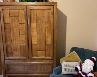 Vintage linen/clothing storage chest made by the Dixie Furniture Co. Upholstered arm chair made by Woodmark Originals