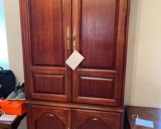 Cherry entertainment cabinet with great storage. 