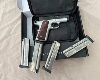 Like new Springfield Ronin EMP 9MM with 4 clips, original box, and soft case.