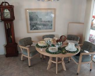 grandmother clock, kitchen table with 4 chairs and leaf