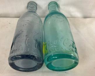 CLOSE UP VIEW STRAIGHTSIDED COKE BOTTLES