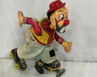 TIN LITHO WIND UP ROLLER BLADE MAN