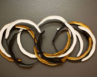 Black, gold and white iron wall decor.  Set of 2 for $200
