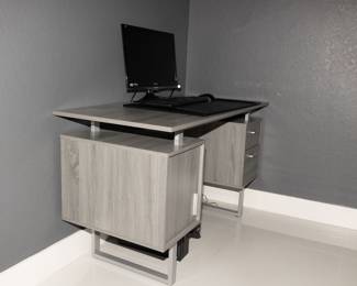 LIGHT GRAY WOODEN DESK
Original Price $500
NOW $250

Modern light gray wooden desk
Matte silver hardware
One cabinet
2 Drawers
Floating desktop

Measurements:  
Width 51 inches
Depth 23.5 inches
Height 30 inches
