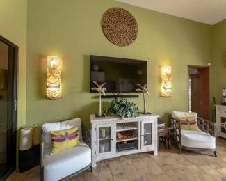 designer bamboo accent chairs, tiki lights, matching console and bar cart (not pictured)