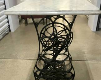 Vtg. Marble top w/sewing machine base $160. - This item is off-site in Willow Springs. Please contact Eric at 708-218-4242 for further information.   PLEASE NOTE - THE OFFSITE ITEMS WILL NOT BE SUBJECT TO ESTATE SALE DISCOUNTING. THANK YOU.