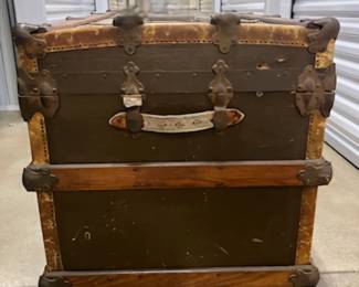 Vtg. Petersen's Steamer trunk $180. - This item is off-site in Willow Springs. Please contact Eric at 708-218-4242 for further information.   PLEASE NOTE - THE OFFSITE ITEMS WILL NOT BE SUBJECT TO ESTATE SALE DISCOUNTING. THANK YOU.
