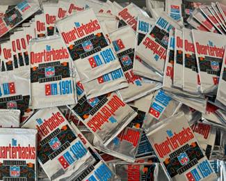 Over 3,000 never opened 1991 Domino’s Pizza “The Quarterbacks” collector cards.  There are 5 cards per pack