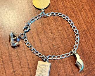 Vintage mixed metal charm bracelet containing both 12kt gold filled, one 9kt and two 14kt gold charms