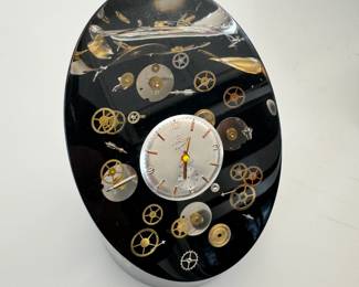 Vintage lucite “Clock Parts” paperweight, attributed to Pierre Giraudon