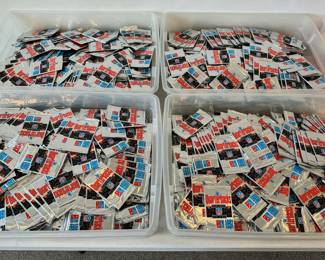 Over 3,000 never opened 1991 Domino’s Pizza “The Quarterbacks” collector cards.  There are 5 cards per pack