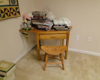 Corner desk and matching chair, with books that need sorting