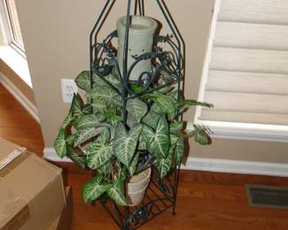 Tall metal plant stand with faux plants