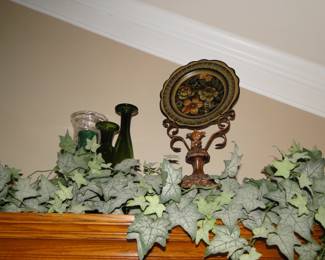 Faux ivy, glass decorative items, and nice metal floral stand art