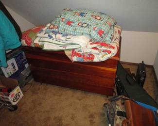 Cedar chest, quilts