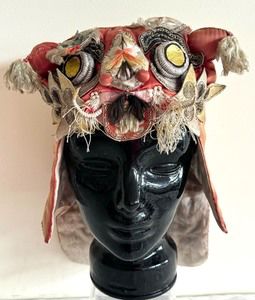 Antique Hand Crafted Embroidered Silk Chinese Tiger Hat. 

Features protruding eye and whiskers. Appears to be for a child. 

Item has significant wear including thinning and tears to the silk fabric. 
