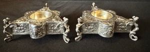 Pair of Fratelli Coppini Italian Baroque Angel Figurine Silver Salt Cellars 

800 Silver, lovely triangle shaped cellars each measuring about 3.5” x 3.5” x 1.5” 