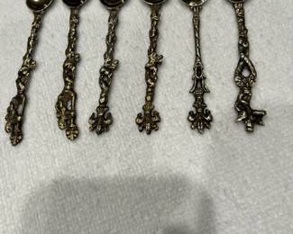 Sterling salt spoons, teaspoons and demitasse spoons. 