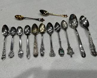 Sterling salt spoons, teaspoons and demitasse spoons. 
