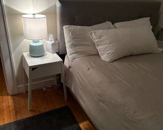 Queen size fabric bed, mattress, bedside tables, pair of lamps 