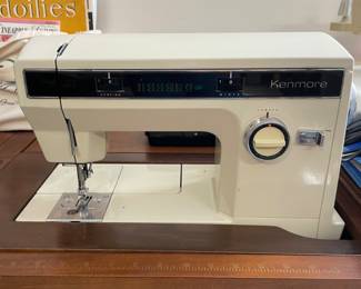 Vintage Sears Kenmore sewing machine with pedal and cabinet