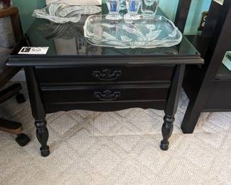 Glass top black side table
